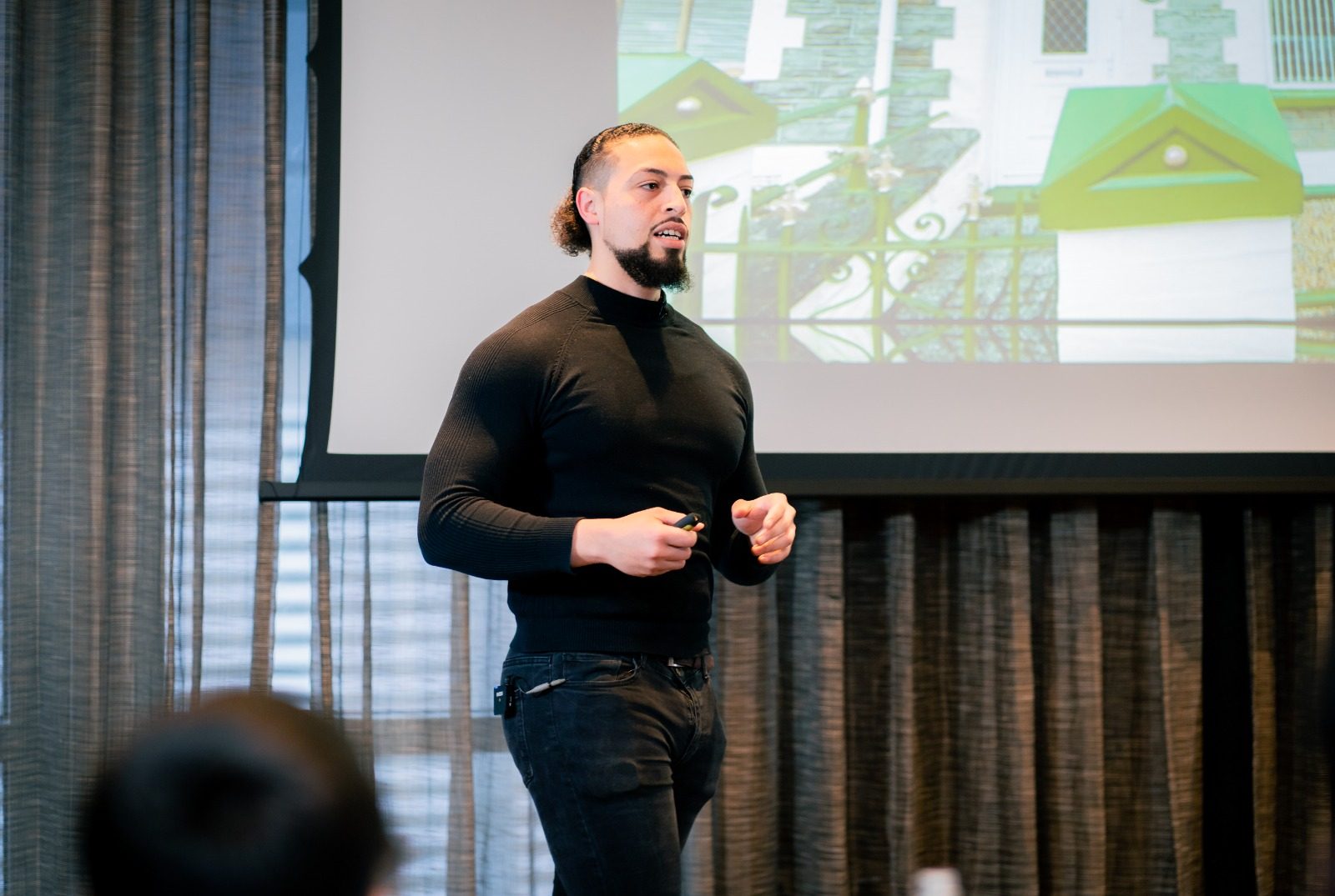 Liam Davies teaching a room of business owners